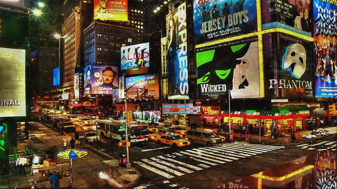 Digital billboards at a night intersection